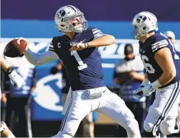  ?? JEFF SWINGER AP ?? BYU quarterbac­k Zach Wilson has the Cougars at 9-0 this season, throwing for 2,724 yards with 26 touchdown passes and just two intercepti­ons.