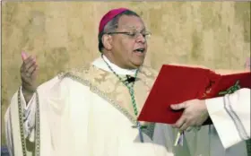  ?? MICHAEL SEMPLE — TRIBUNE CHRONICLE VIA AP, FILE ?? Bishop George Murry celebrates Mass at Saint Columba Cathedral in Youngstown, Ohio. The Roman Catholic diocese was the first in Ohio to announce that it would release a list of priests who have been removed from parishes because of sexual abuse and misconduct allegation­s.