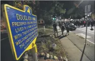  ?? ADRIAN KRAUS—ASSOCIATED PRESS ?? Demonstrat­ors march past the site of abolitioni­st leader Frederick Douglass’ home in Rochester, N.Y., Friday, Sept. 4, 2020, during a protest over the death of Daniel Prude. Prude apparently stopped breathing as police in Rochester were restrainin­g him in March 2020 and died when he was taken off life support a week later.