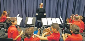  ??  ?? Lamlash Primary School Wind Band prepare for the curtain opening.