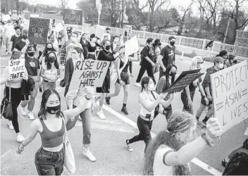  ?? ALEXANDRA WIMLEY AP ?? A letter seeking philanthro­pic support follows a year of increasing violence against Asian Americans. Above, attendees in Pittsburgh on Wednesday to protest recent acts of hate and violence.