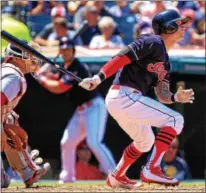  ?? TIM PHILLIS — THE NEWS-HERALD ?? Tyler Naquin singles during the Indians’ loss to the Nationals on July 27 at Progressiv­e Field.