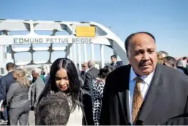  ?? ALBERT CESARE/THE MONTGOMERY ADVERTISER VIA AP ?? Martin Luther King III stands on the Edmund Pettus Bridge on Sunday in Selma, Ala., during the annual commemorat­ion of “Bloody Sunday.”