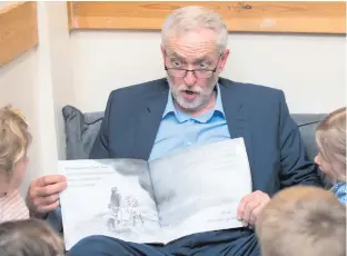  ??  ?? Theresa May talks to students at Cox Green School in Maidenhead yesterday, and Labour leader Jeremy Corbyn reads We’re Going On A Bear Hunt to children in Bristol