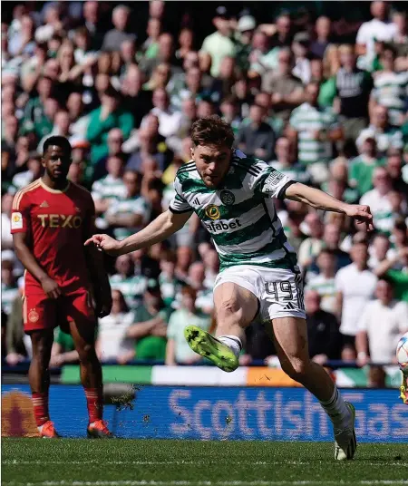  ?? ?? James Forrest scores to make it 2-1 to Celtic after coming on as a substitute. The winger also had a hand in Matt O’Riley’s third goal