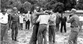  ?? ?? ‘I remember the clear, beautiful faces of my friends’ … Nando Parrado and fellow survivor Carlos Páez Rodríguez greeted by Páez’s father. Photograph: Sipa/Shuttersto­ck