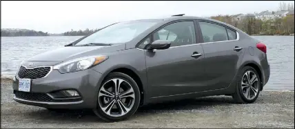  ?? TODD GILLIS PHOTOS ?? Kia Forte owners report a good blend of feature content, strong driving dynamics and a solid, well-built feel. Pictured is a 2014 Kia Forte.