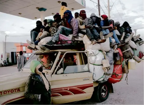  ?? CARMEN ABD ALI/NEW YORK TIMES ?? Men returned from Libya on the way back to their countries of origin, in Agadez, Niger, last month.