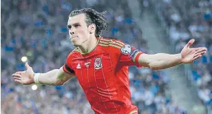  ?? Photo: REUTERS ?? Welsh wizard: Gareth Bale celebrates scoring his team's second goal against Israel in Haifa.