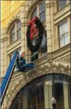  ??  ?? Christmas decoration­s are placed around downtown Troy in 2017.