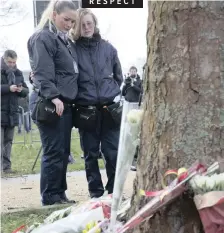  ?? PETER DEJONG AP African News Agency (ANA) ?? TWO women mourn at the site of a shooting incident on a tram in Utrecht, the Netherland­s, yesterday. A gunman killed three people and wounded others on the tram in the central Dutch city on Monday. |