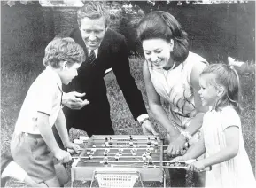  ??  ?? NEXT IN LINE: With sister Elizabeth at Windsor in 1942, above; with husband Lord Snowdon and their children David and Sarah at their London home in 1969