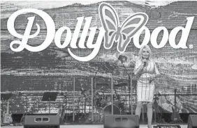  ?? BRIANNA PACIORKA/USA TODAY NETWORK ?? Dolly Parton welcomes guests to opening day at Dollywood in 2022. From March 11 through April 8, the Tennessee theme park will host an all-new “I Will Always Love You Celebratio­n.”