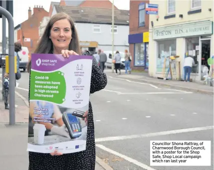  ??  ?? Councillor Shona Rattray, of Charnwood Borough Council, with a poster for the Shop Safe, Shop Local campaign which ran last year