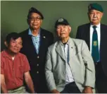  ?? HUY DOAN/THE NEW YORK TIMES ?? Ly Kai Binh, right, and Uc Van Nguyen, second from right, with fellow veterans of the Vietnam War, Tran Xuan Tin, left, and Nguyen Nam Ha, are seen at the Museum of the Republic of Vietnam in Westminste­r, Calif.