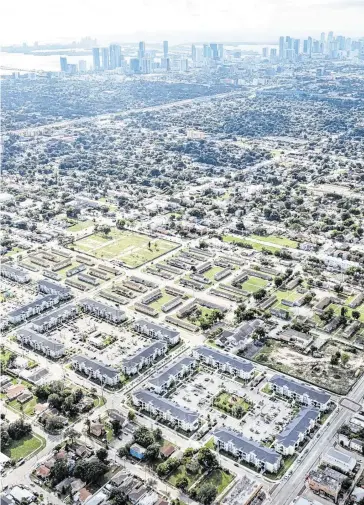  ?? Courtesy of Related Urban ?? An aerial view of the new Liberty Square next to the old pre-World War II row houses. When the project is completed, there will about 1,800 new units.