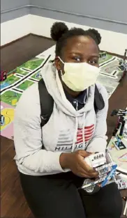  ?? Julia Malakie / LOWELL sun ?? Kemigisa adyeri, 15, of Lowell, who was selected as the Boys & Girls Club of Greater Lowell's youth of the year, enjoys robotics at the club.