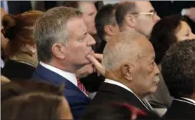  ?? RICHARD DREW — THE ASSOCIATED PRESS ?? New York Mayor Bill de Blasio, left, and former Mayor David Dinkins listen as New York Gov. Andrew Cuomo delivers one of his State of the State addresses in New York’s One World Trade Center building, Monday. NewYork state must stand as an alternativ­e...