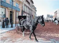  ?? CLIFFORD SKARSTEDT EXAMINER FILE PHOTO ?? In the 1800s, there were many races down George Street in downtown Peterborou­gh involving multi-horsepower vehicles. Horses again took over King Street in downtown Millbrook in 2016 for filming of scenes for the “Anne with an E” TV series.