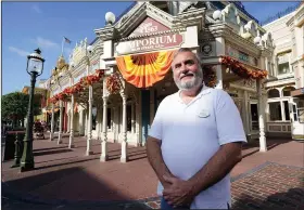  ?? ?? Chuck Milam, who will celebrate his 50 years at Disney on Friday, stands Aug. 30 on Main Street in the Magic Kingdom theme park at Walt Disney World.