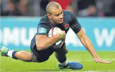  ??  ?? Jonathan Joseph goes over for England’s seventh try against Fiji at Twickenham.