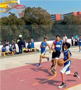  ??  ?? Arnav of DPS Hyderabad moves in to score against St Andrews School in their Indian School Basketball League match.