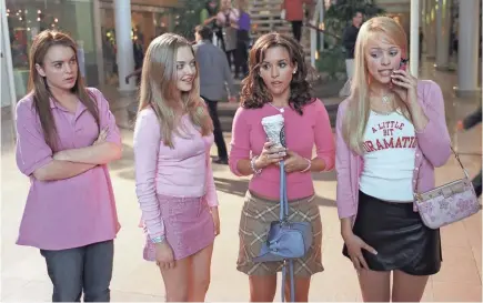  ?? MICHAEL GIBSON/PARAMOUNT PICTURES ?? Cady (Lindsay Lohan, left) tries to fit in with Karen (Amanda Seyfried), Gretchen (Lacey Chabert) and Regina (Rachel McAdams) in 2004’s “Mean Girls.”