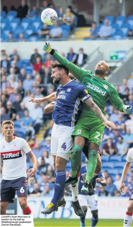  ??  ?? Cardiff’s Sean Morrison is beaten to the ball by Middlesbro­ugh goalkeeper Darren Randolph.