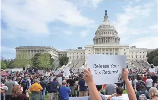  ?? MANDEL NGAN/AFP/GETTY IMAGES ?? Hundreds of protesters take part Saturday in the Tax Day march in Washington.