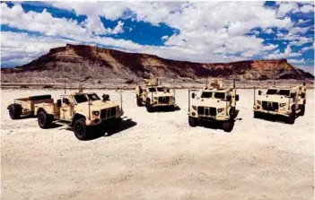  ??  ?? (Top) A view of the fair; (middle) Lockheed Martin’s Warrior IFV; (above) Oshkosh JLTV.