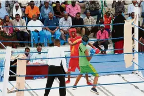  ?? — AFP ?? Fighting for glory: Somali boxers fighting in a ring installed at the Wish Stadium in Mogadishu.