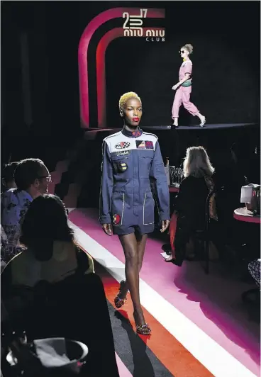  ?? VICTOR BOYKO / GETTY IMAGES FOR MIU MIU ?? Newcomer Hanna Sylla, a former hotel waitress, walks the runway during the Miu Miu Cruise Collection show as part of Haute Couture Paris Fashion Week on Sunday.