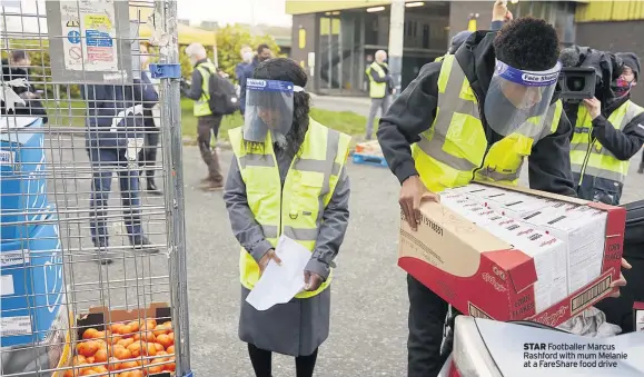  ??  ?? STAR Footballer Marcus Rashford with mum Melanie at a FareShare food drive