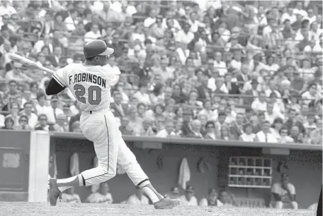  ?? AP FILE ?? Frank Robinson takes a rip during the 1966 season, when he hit for the Triple Crown and led the Orioles to the world title. When he retired after the 1976 season, he was fourth on the all-time home run list with 586.