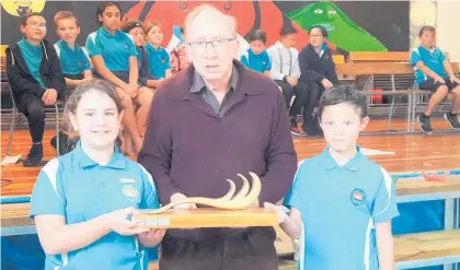  ??  ?? Coast Care co-ordinator Graham Pearson with Castleclif­f School students Nirvana George (left) and Journey TePania.