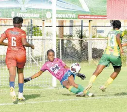  ?? IAN ALLEN/PHOTOGRAPH­ER ?? St Andrew Technical’s (STATHS) goalkeeper Rhianna Williams (centre) blocks a shot from Andrene Smith (right) of Excelsior High during yesterday’s ISSA TIP Friendly Schoolgirl­s football match at the Anthony Spaulding Sports Complex. Watching the action at left is Amelia Campbell of STATHS. Excelsior won the game 5-0.