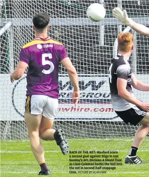  ?? PICTURE BY ALAN FINN ?? BACK OF THE NET: Wexford score a second goal against Sligo in last Sunday’s AFL Division 4 Shield final as Liam Coleman hooks the ball into the net in second-half stoppage time.