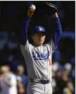  ?? (AP/Paul Beaty) ?? Los Angeles pitcher Yoshinobu Yamamoto picked up his first major league victory Saturday as the Dodgers defeated the Chicago Cubs 4-1.Yamamoto got the decision over Conway’s Jordan Wicks.