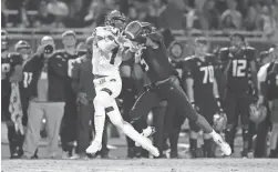  ?? ZAC BONDURANT/SPECIAL TO THE REPUBLIC ?? Joel Gant (5) breaks up a pass on Kyion Grayes (1) during the HamiltonCh­andler game Nov. 12 in Chandler.