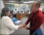  ??  ?? Coatesvill­e police Officer Jared Davis was one of 28 Chester County law enforcemen­t officers who took part in crisis interventi­on training this week. He accepts his certificat­e from Chester County Commission­er Kathi Cozzone.