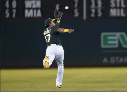  ?? JEFF CHIU — THE ASSOCIATED PRESS ?? A’s shortstop Elvis Andrus catches a lineout hit by Seattle Mariners’ J.P. Crawford during the third inning in Oakland on Wednesday.