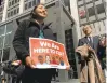  ?? HAVEN DALEY/ ASSOCIATED PRESS ARCHIVES ?? Erica Leyva carries a sign on April 14 outside a courthouse in San Francisco.