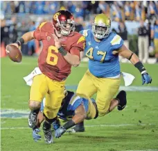  ?? RICHARD MACKSON, USA TODAY SPORTS ?? UCLA’s Eddie Vanderdoes, right, shown in 2014, was limited to one game in 2015 but returns to bolster the defense this year.