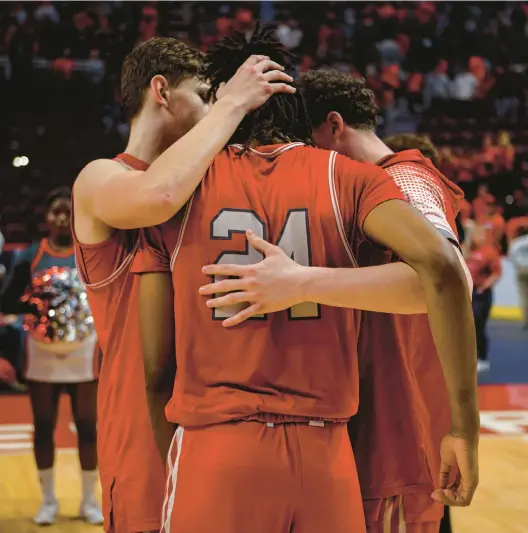  ?? JANE THERESE/PHOTOS SPECIAL TO THE MORNING CALL ?? Parkland players console each other after their loss in the state championsh­ip game on Saturday in Hershey.