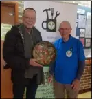  ?? ?? Terje Hartberg and Brian Watts with the repaired traditiona­l Norwegian bowl