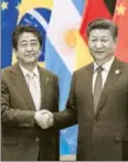  ?? GETTY ?? Japanese prime minister Shinzo Abe (left) and Chinese president Xi Jinping