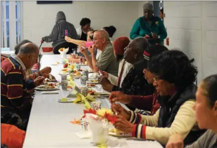  ?? MARIAN DENNIS — DIGITAL FIRST MEDIA ?? Hundreds of community members showed up to Pottstown Middle School Saturday to celebrate Thanksgivi­ng early. Guests enjoyed a Thanksgivi­ng meal, group prayer and a dance performanc­e.