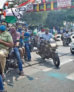  ??  ?? TRINAMOOL CONGRESS activists celebrate in Kolkata on May 2 as trends start pointing to a huge win.