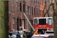  ?? (AP/Matt Rourke) ?? Firefighte­rs work Wednesday at the scene of a deadly blaze in the Fairmount neighborho­od of Philadelph­ia.