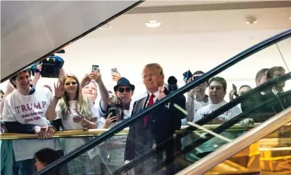  ?? Photograph: Christophe­r Gregory/Getty Images ?? Donald Trump’s escalator ride at Trump Tower in June 2015 in which he announced his candidacy for president.